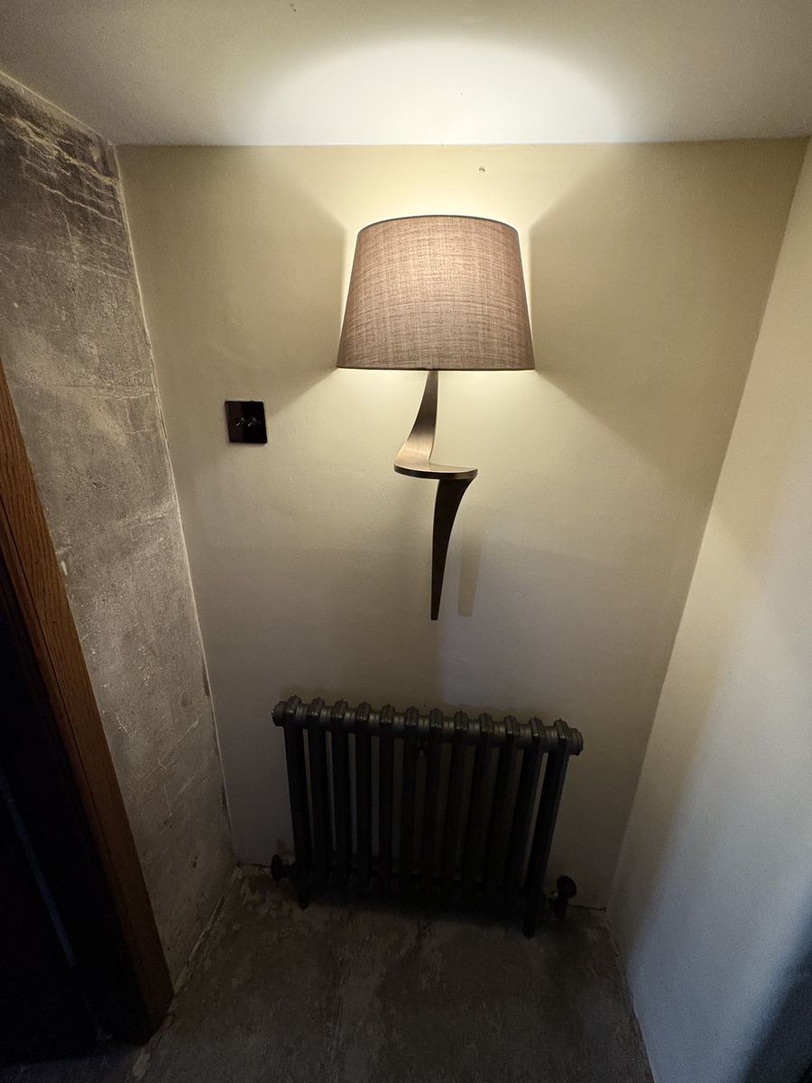 Bronze wall light and dimmer switch installed in Bristol